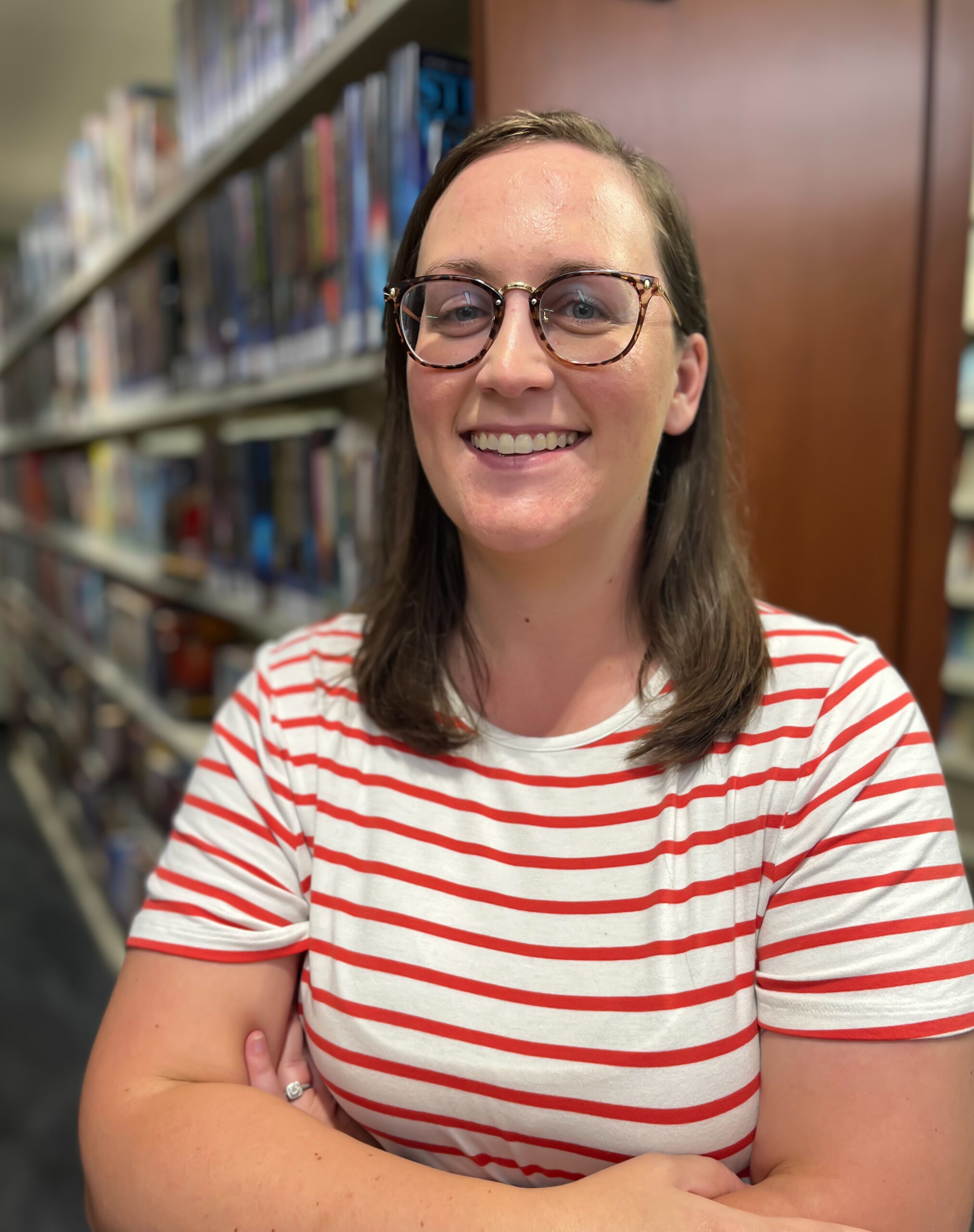 SamanthaJackson Woman with brown hair and glasses with red and white striped shirt
