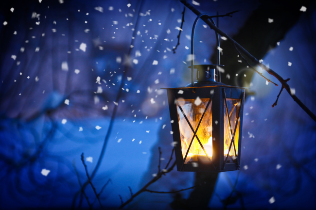 A glowing lantern on a snowy night