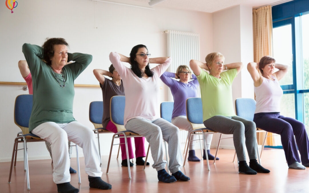 Two rows of women doing chair yoga