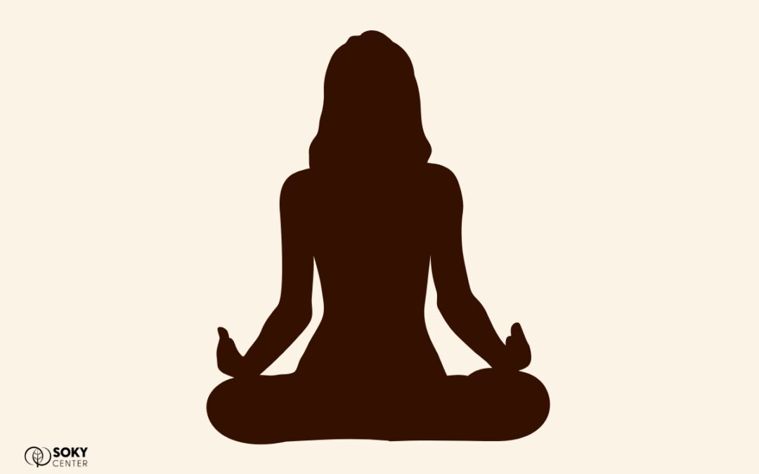 a silhouette of a person in a yoga pose