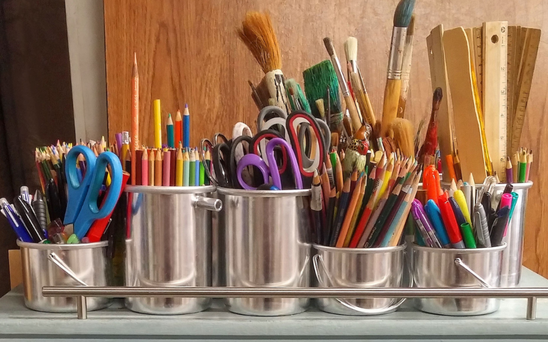 Metal cups full of crafting materials