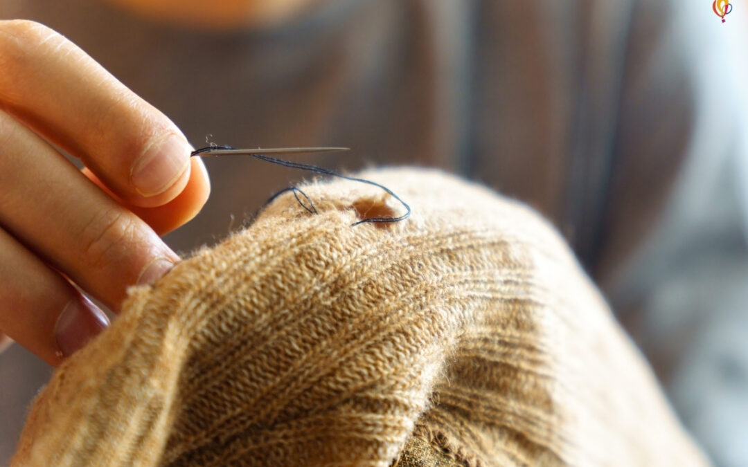 Hand sewing an article of clothing