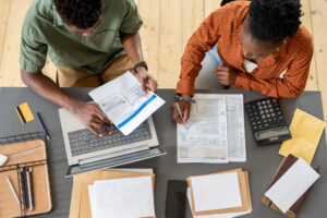 Overview of two young economists discussing finances