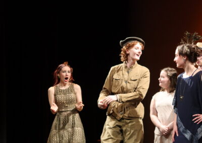 an actor in a uniform making a point