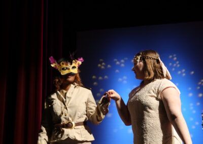 two actresses with masks