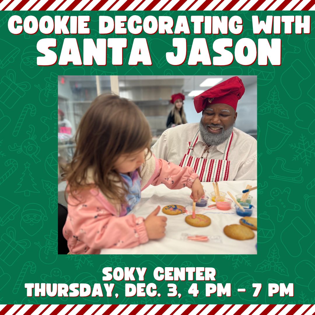 Santa Jason decorating cookies with a little girl